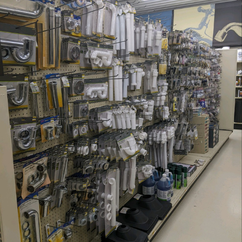Plumbing supplies on shelves inside of Dauby's True Value Hardware.